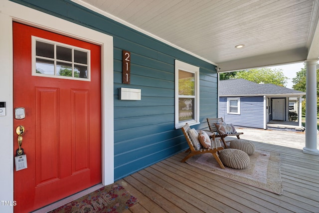 wooden terrace with a porch