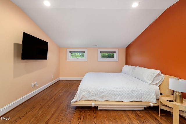 bedroom featuring recessed lighting, baseboards, wood finished floors, lofted ceiling, and visible vents