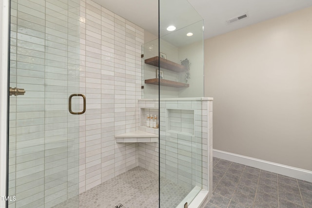 bathroom with visible vents, a tile shower, baseboards, tile patterned floors, and recessed lighting