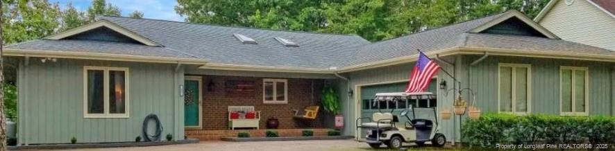 back of house featuring a garage