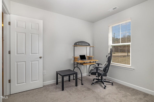 office space featuring baseboards, visible vents, and carpet flooring