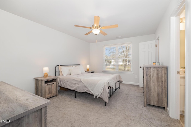 bedroom with baseboards, a ceiling fan, and light colored carpet