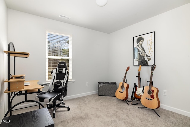 carpeted home office with visible vents and baseboards