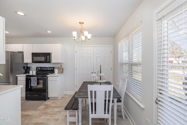 dining area featuring an inviting chandelier, baseboards, and recessed lighting