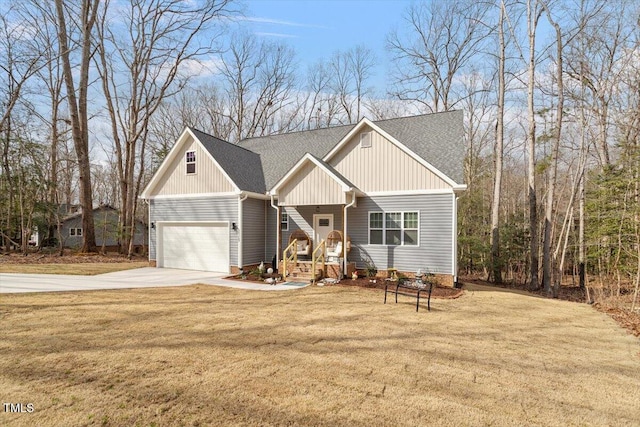 craftsman inspired home featuring a garage, roof with shingles, concrete driveway, and a front yard