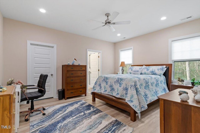 bedroom with ceiling fan, light wood finished floors, visible vents, and recessed lighting