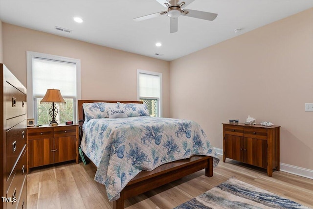 bedroom with recessed lighting, visible vents, light wood-style flooring, a ceiling fan, and baseboards