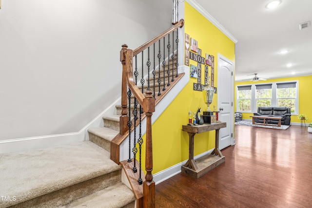 stairway with ornamental molding, recessed lighting, baseboards, and hardwood / wood-style flooring