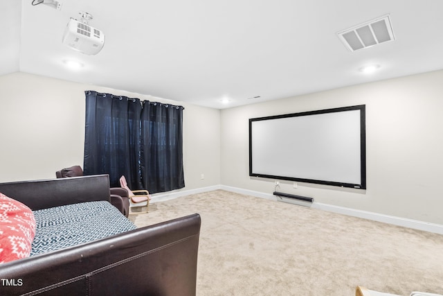 carpeted cinema room featuring lofted ceiling, recessed lighting, visible vents, and baseboards