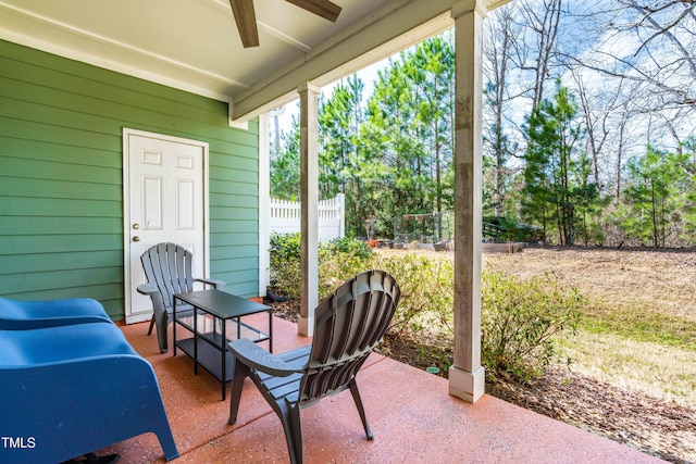 view of patio / terrace featuring a ceiling fan and fence