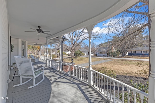 wooden deck featuring a ceiling fan