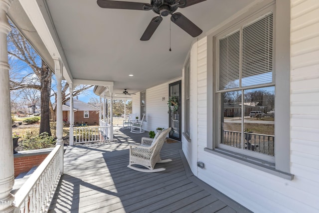 deck with covered porch and ceiling fan