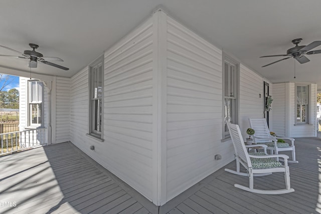 wooden deck featuring ceiling fan and a porch