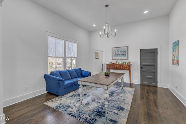 living room featuring a chandelier, recessed lighting, wood finished floors, and baseboards