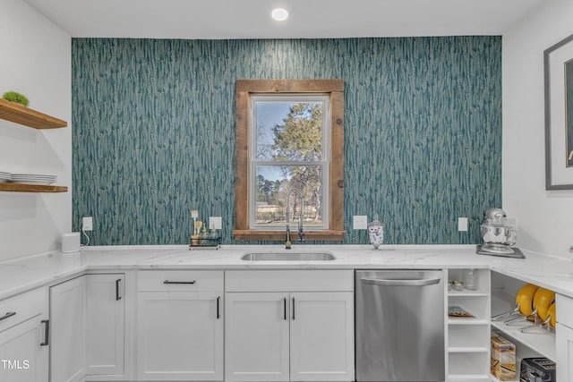 kitchen featuring dishwasher, open shelves, a sink, and white cabinets