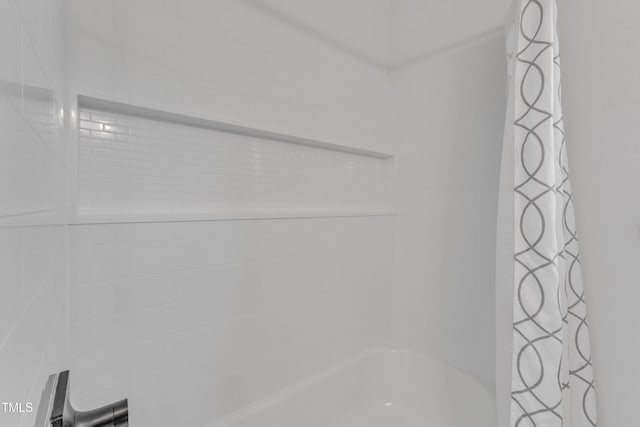 bathroom featuring shower / tub combo with curtain