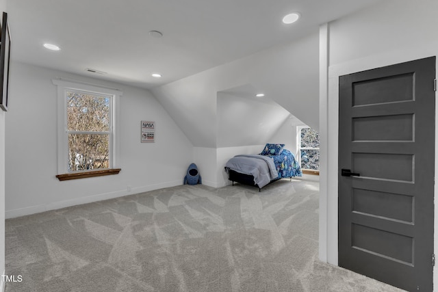 unfurnished bedroom featuring vaulted ceiling, recessed lighting, carpet flooring, and baseboards