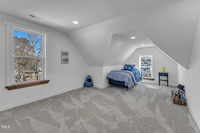 unfurnished bedroom with lofted ceiling, recessed lighting, carpet floors, visible vents, and baseboards