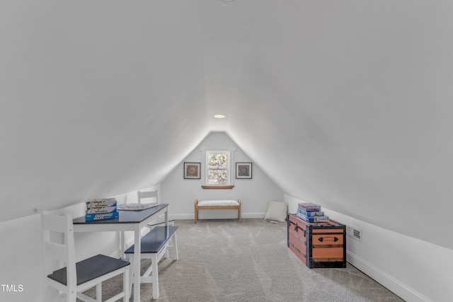 office area with lofted ceiling, carpet floors, visible vents, and baseboards