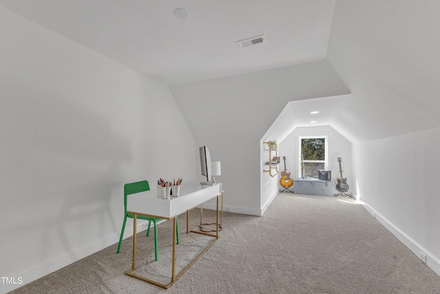 home office with lofted ceiling, carpet floors, visible vents, and baseboards