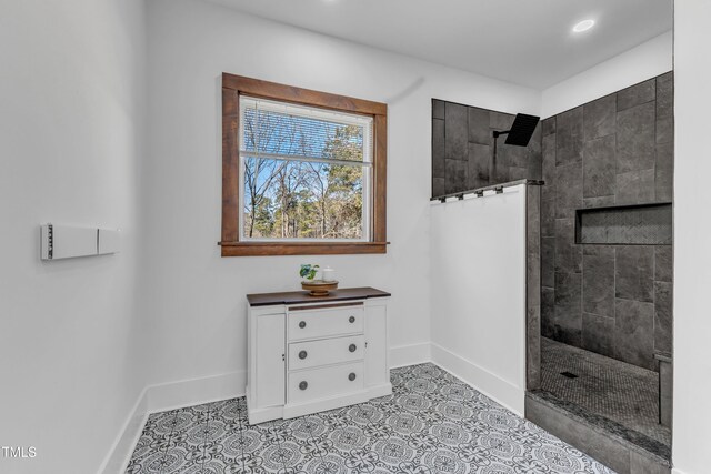 bathroom with a walk in shower, recessed lighting, tile patterned flooring, and baseboards