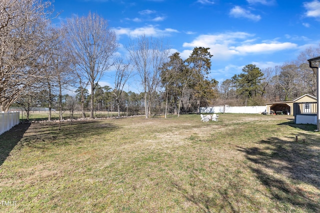 view of yard with fence