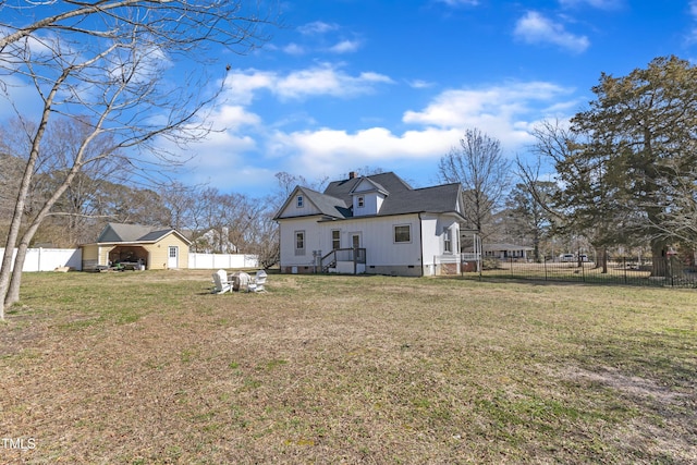 back of house featuring roof with shingles, crawl space, a fenced backyard, and a lawn