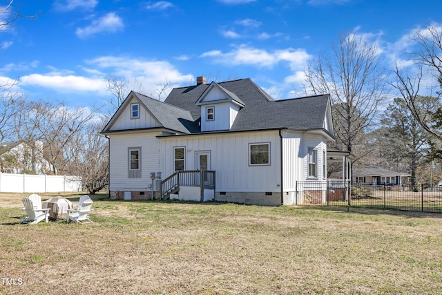 back of house featuring a yard, crawl space, a chimney, and fence private yard