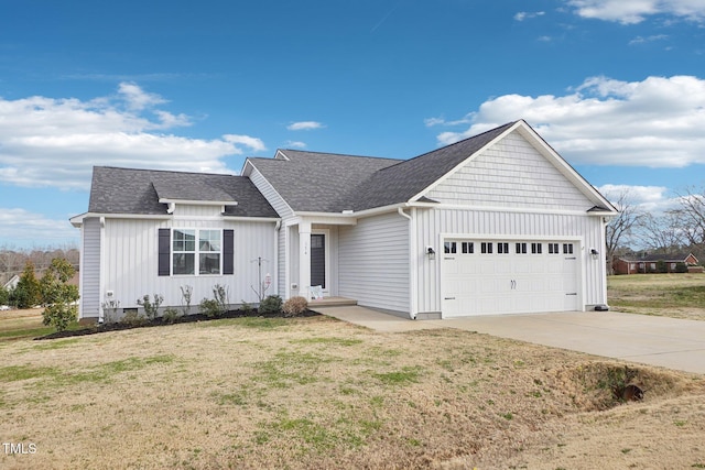 ranch-style home featuring a garage, concrete driveway, roof with shingles, a front lawn, and board and batten siding