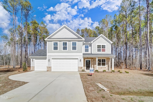 view of front of home with a garage, stone siding, a porch, and concrete driveway