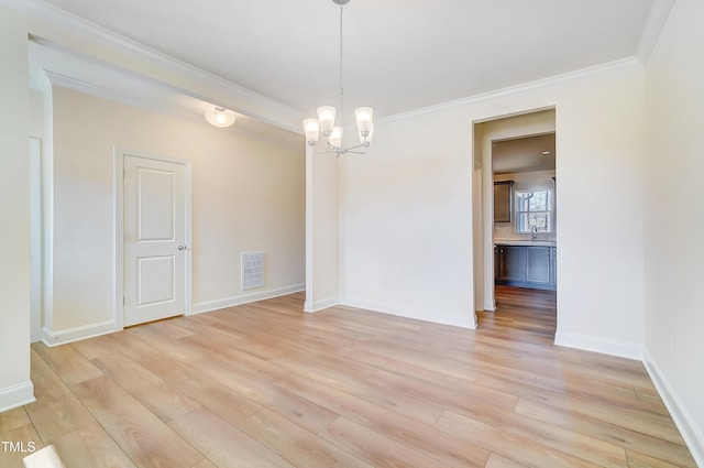 unfurnished dining area featuring crown molding, a notable chandelier, visible vents, light wood-style flooring, and baseboards