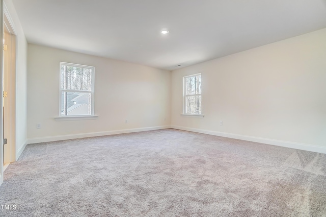 unfurnished room with baseboards, carpet flooring, and recessed lighting