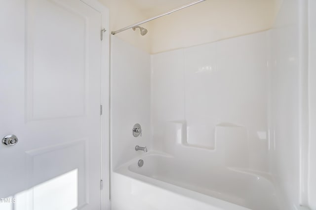 bathroom with shower / washtub combination