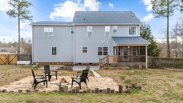 back of house featuring a fire pit, fence, a sunroom, crawl space, and a gate