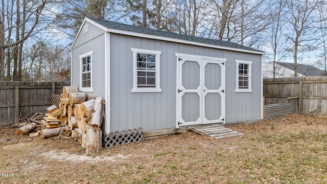 view of shed with a fenced backyard