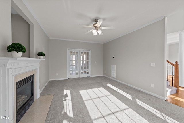 unfurnished living room with ornamental molding, a fireplace, and stairway