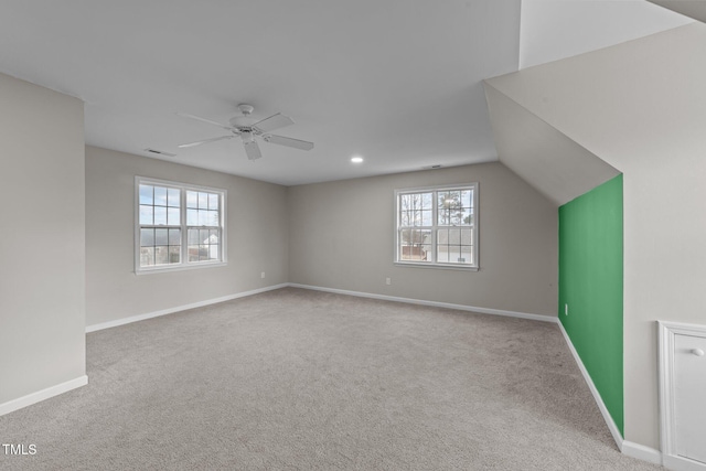 bonus room with ceiling fan, carpet flooring, visible vents, and baseboards