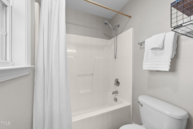 full bath featuring toilet and shower / bathtub combination with curtain