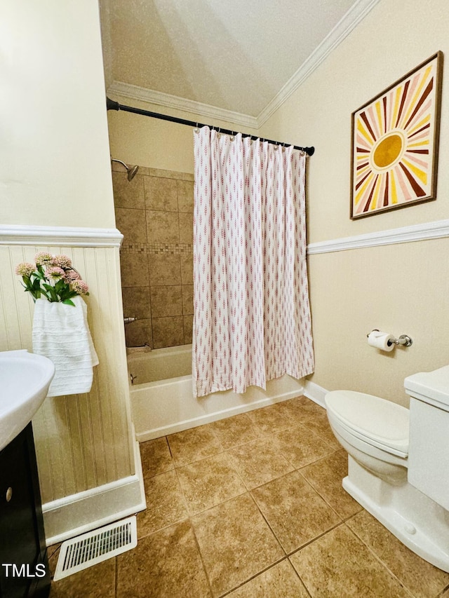 full bath with shower / tub combo, visible vents, toilet, tile patterned flooring, and crown molding