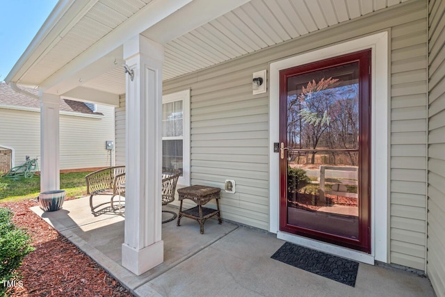 entrance to property featuring covered porch