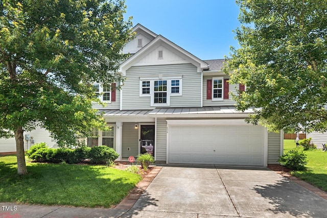 634 Conover Rd, Durham, NC 27703 - traditional home with a standing seam roof, an attached garage, driveway, and a front yard