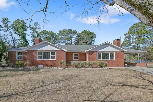 ranch-style house featuring crawl space, a chimney, and an attached carport