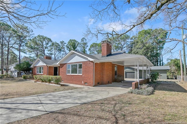 single story home featuring brick siding, a chimney, crawl space, an attached carport, and driveway