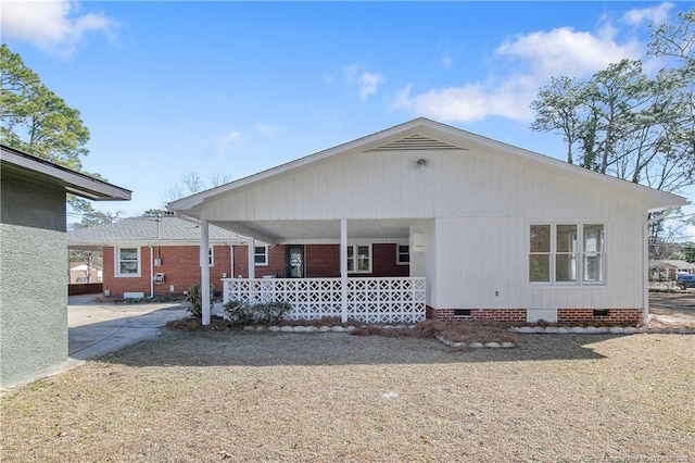 back of property with covered porch and crawl space