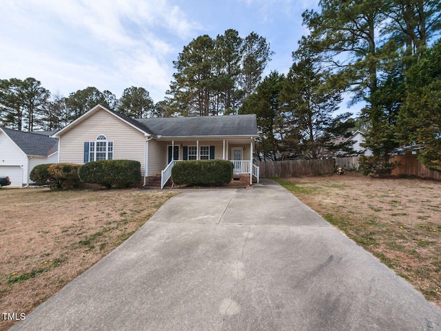 ranch-style home with a porch, a front yard, and fence