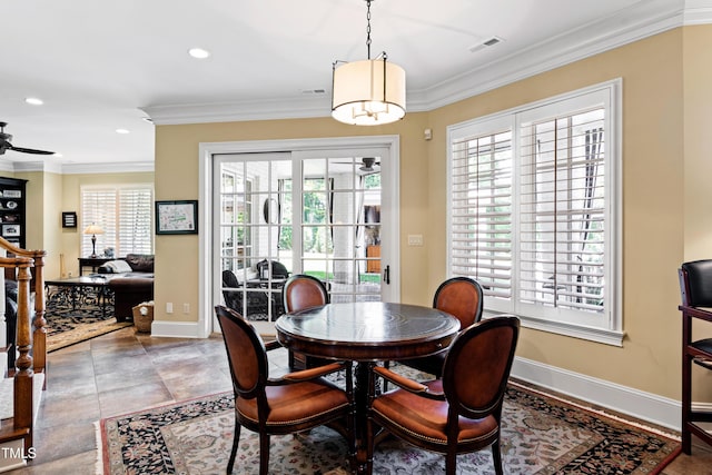 dining area with ornamental molding, visible vents, and baseboards