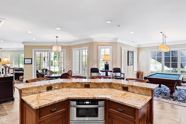 kitchen with open floor plan, a healthy amount of sunlight, and hanging light fixtures