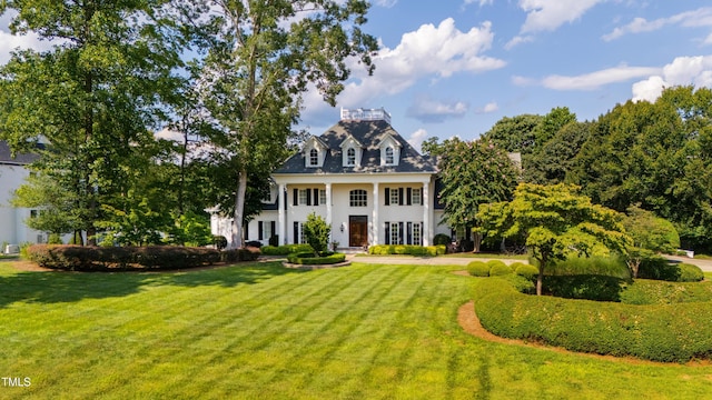 greek revival house with a front lawn