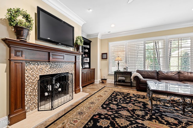 living area featuring visible vents, baseboards, a tiled fireplace, crown molding, and recessed lighting