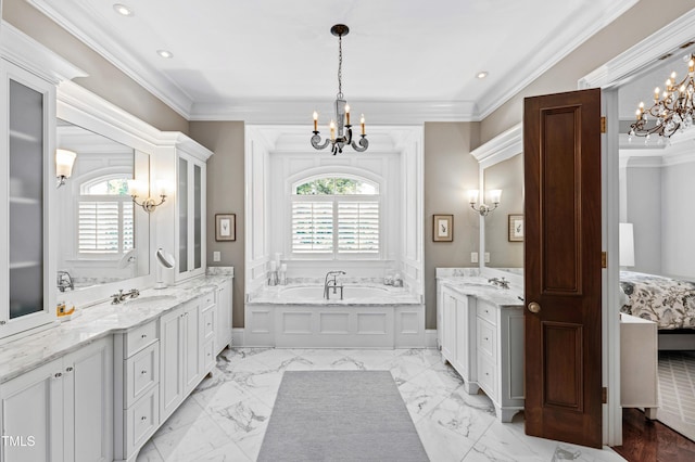 bathroom featuring a sink, an inviting chandelier, and crown molding